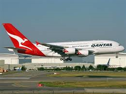 Qantas underlying profit doubles as international losses shrink