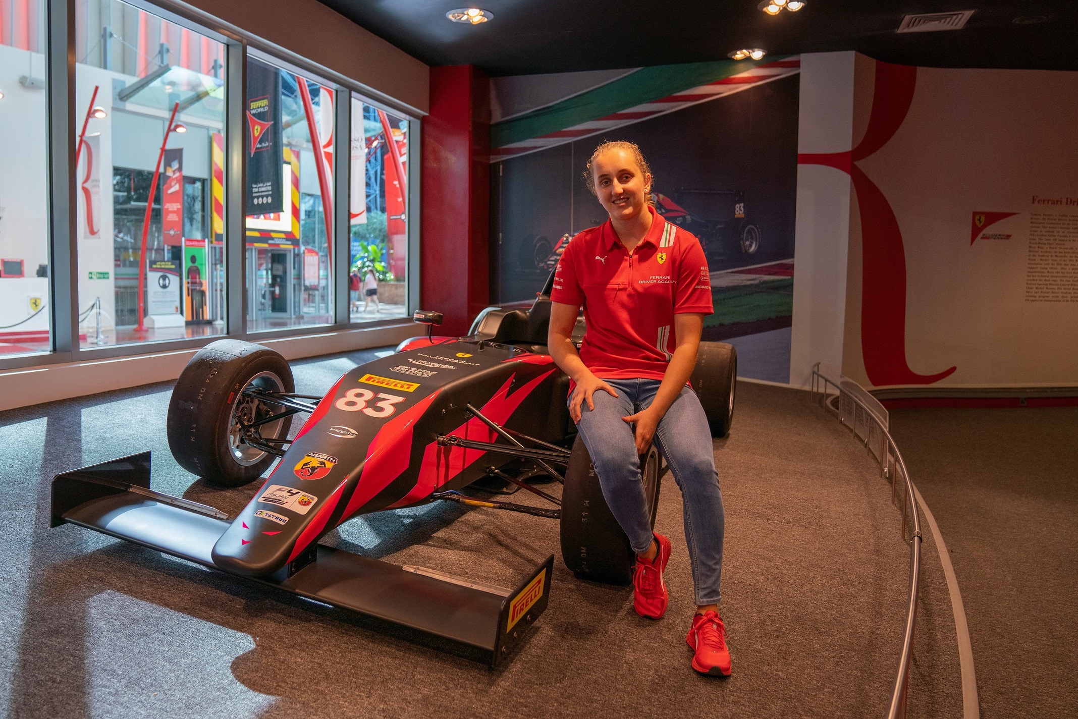 First female member of the Ferrari Driver Academy Maya Weug visits Ferrari World Abu Dhabi